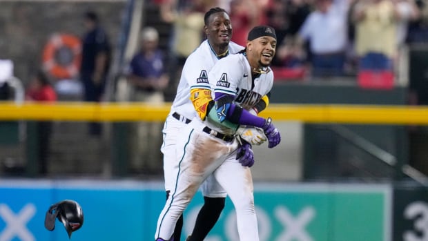 Diamondbacks’ Ketel Marte (4) celebrates his walk-off single with Geraldo Perdomo in Game 3 of the NLCS against the Phillies.